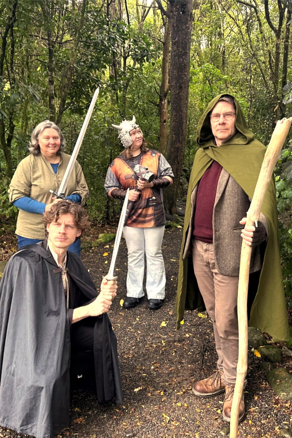 A man and a woman stand together on a street corner staring at a paper